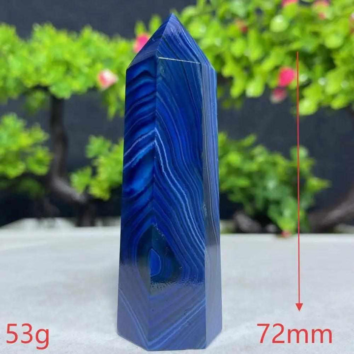 Polished Blue Lace Agate tower featuring calming deep blue and white ripple bands, perfect for Throat Chakra healing.