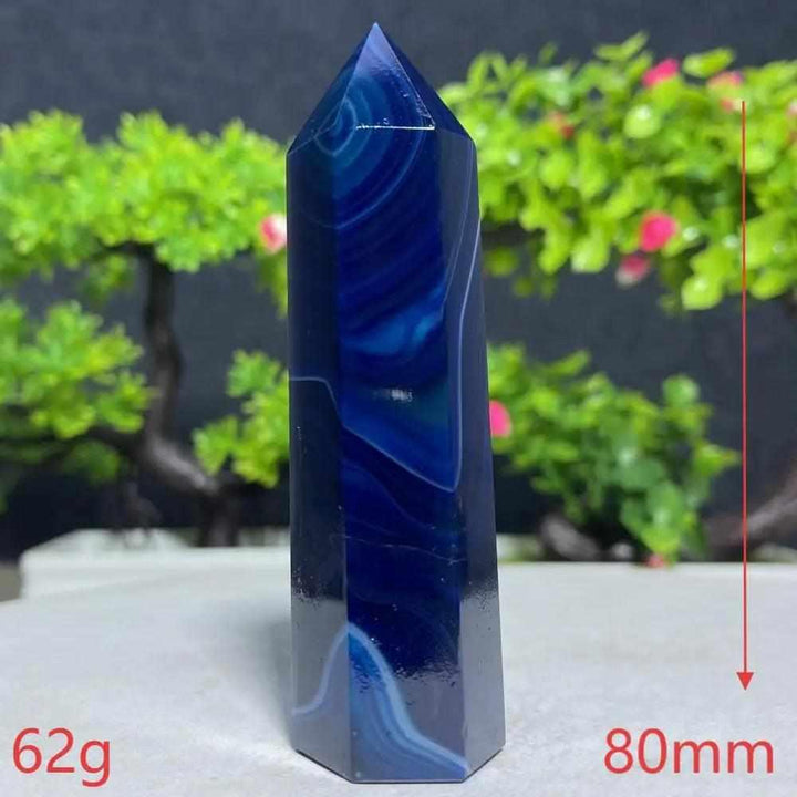 Polished Blue Lace Agate tower featuring calming deep blue and white ripples, perfect for throat chakra healing and decor.