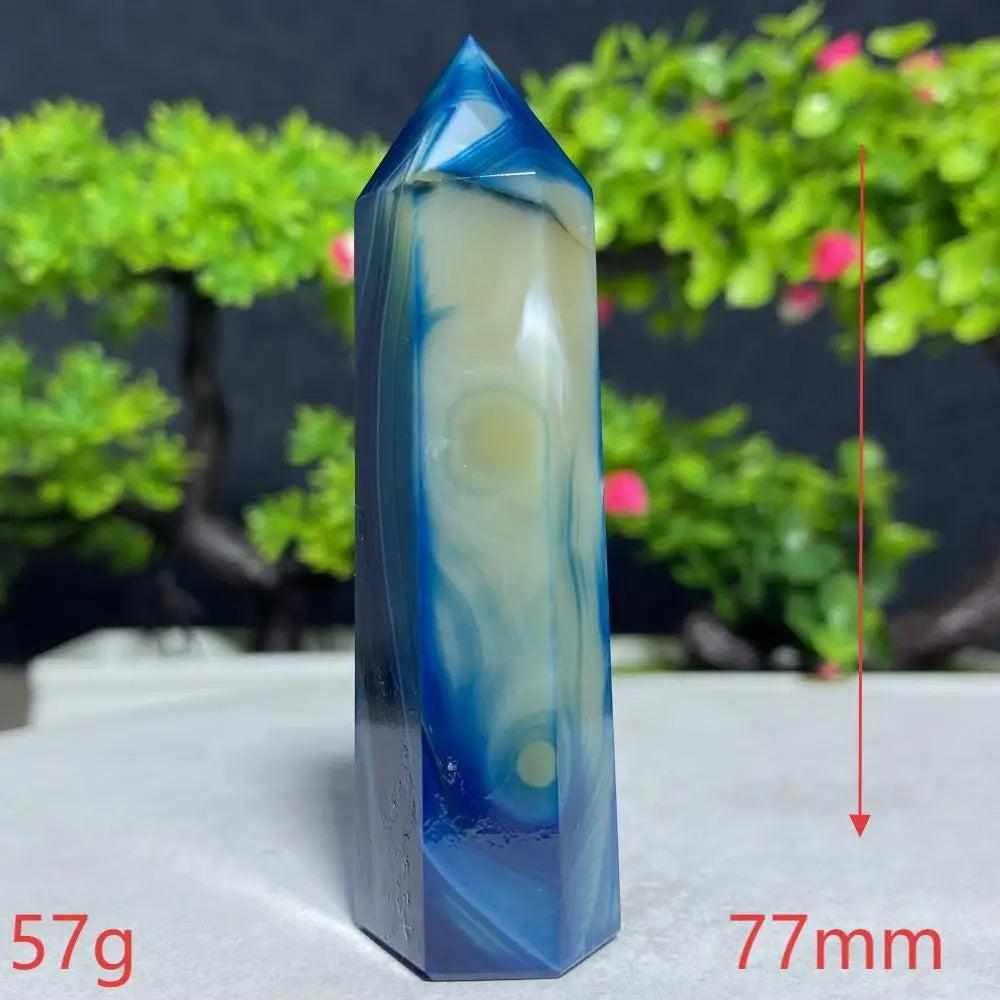 Polished Blue Lace Agate tower featuring calming sky-blue and white bands for throat chakra healing and peaceful energy.