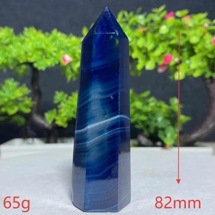 Polished Blue Lace Agate tower featuring deep blue and white calming bands, perfect for throat chakra healing and focus.