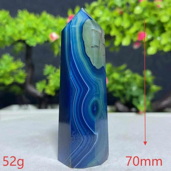 Polished Blue Lace Agate tower featuring calming sky-blue and white bands for Throat Chakra healing and peaceful energy.