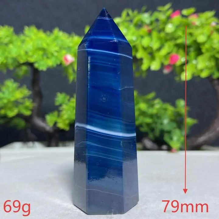 Polished Blue Lace Agate tower featuring calming sky-blue and white bands, perfect for Throat Chakra healing and tranquility.