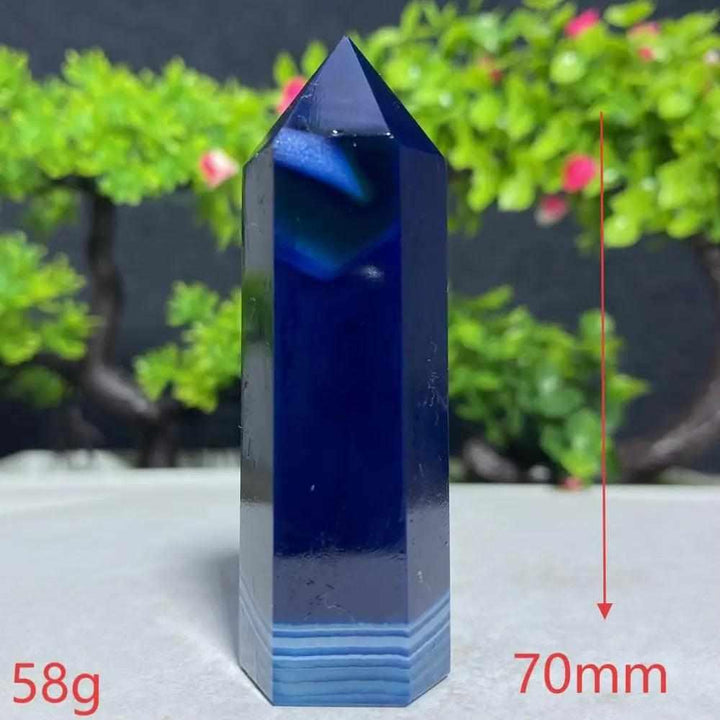 Polished Blue Lace Agate tower with deep blue hues and delicate white banding, perfect for Throat Chakra healing.