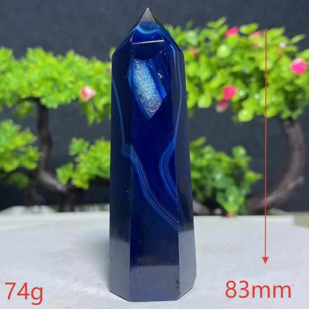 Polished Blue Lace Agate tower with deep blue banded patterns, perfect for Throat Chakra calm and gentle communication.