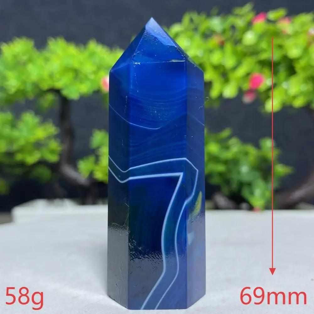 Polished Blue Lace Agate tower with calming sky-blue and white bands for throat chakra healing and peaceful energy.