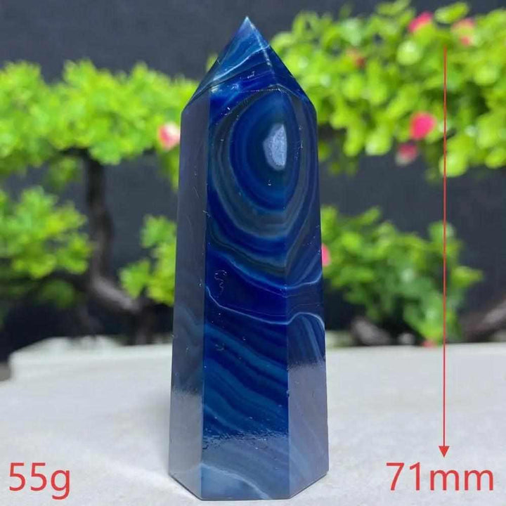 Polished Blue Lace Agate tower featuring calming deep blue and white ripples to promote peace and throat chakra balance.