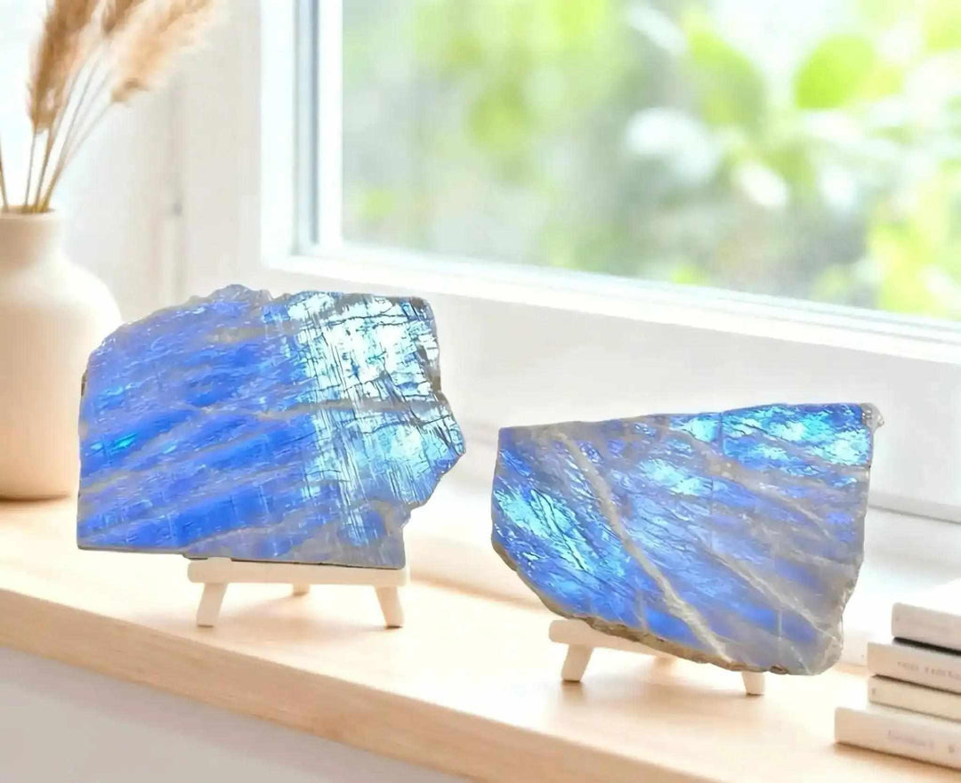 Polished Blue Moonstone slab with a vibrant blue flash, displayed on a wooden easel for intuitive healing and decor.