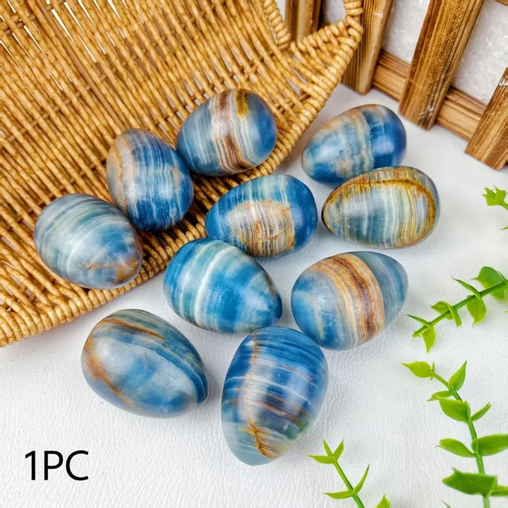 Polished Blue Onyx Crystal Eggs, banded slate and sky hues, for calm focus and grounding energy.