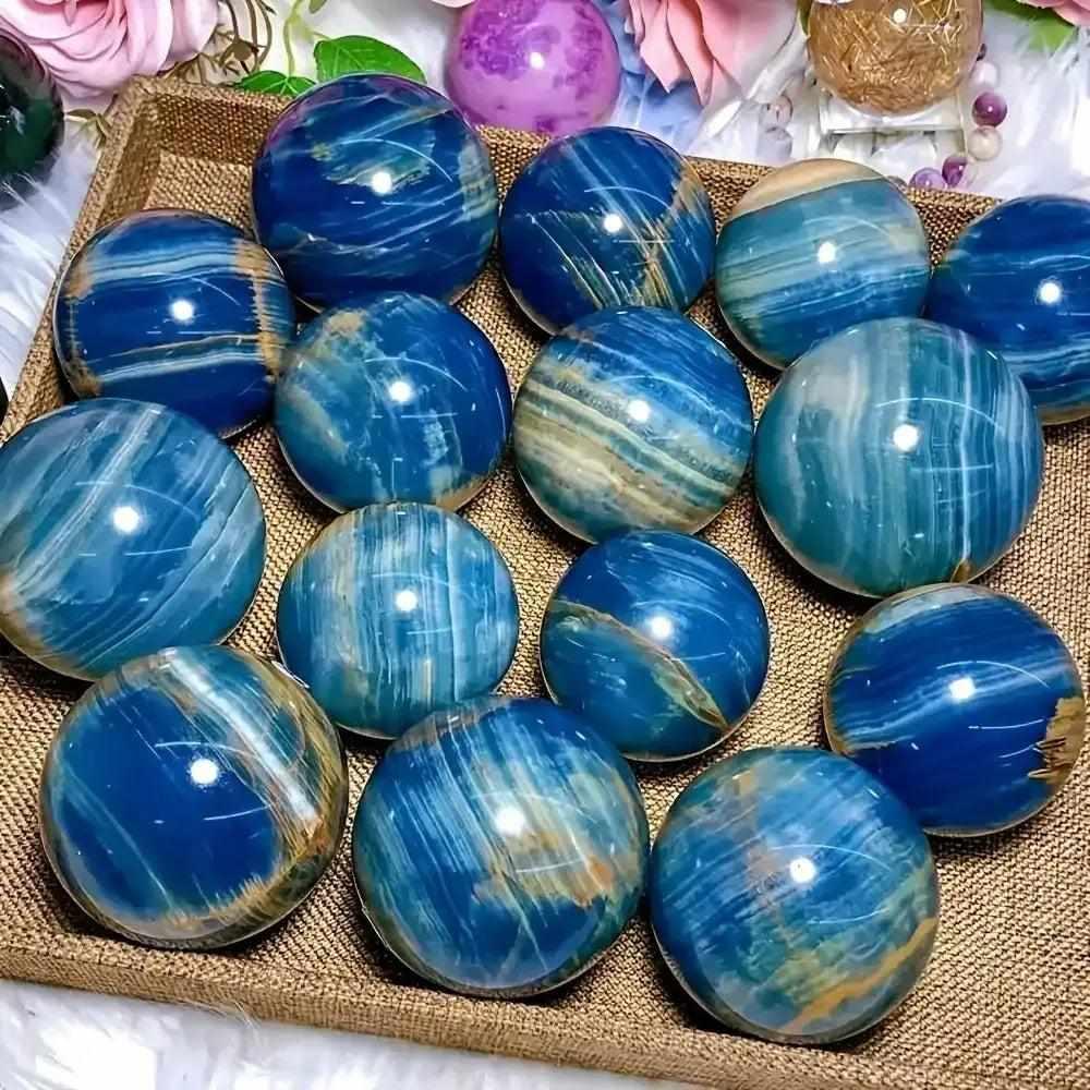 Polished Blue Onyx spheres featuring deep blue layered bands, perfect for Throat and Third Eye chakra meditation.