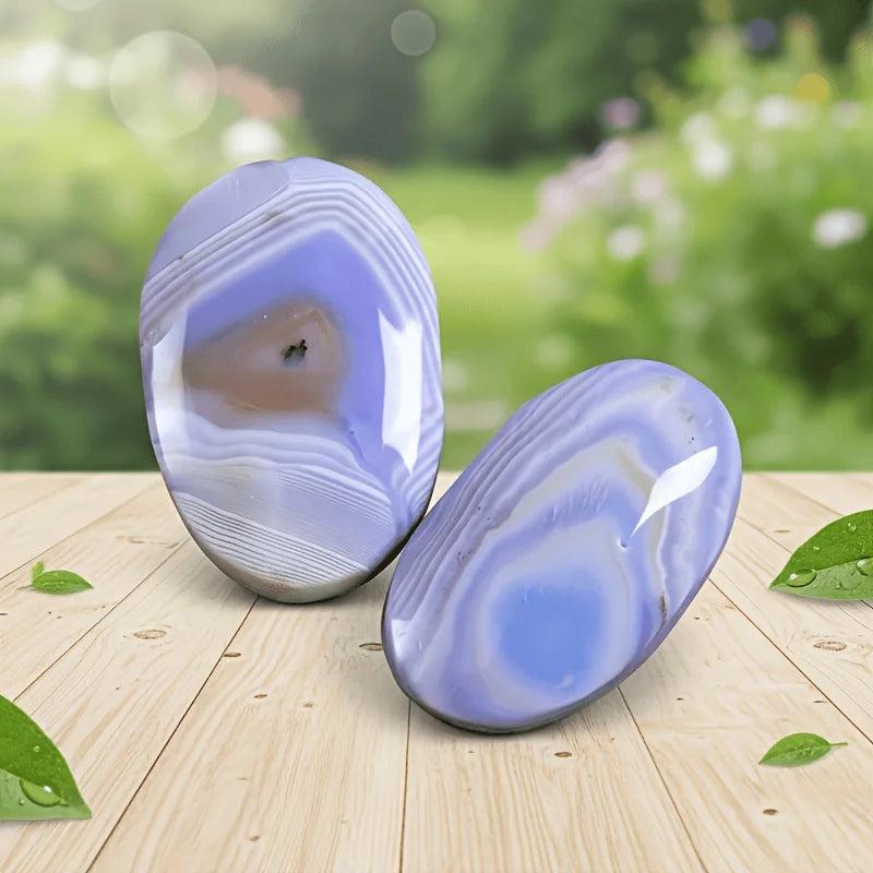 Polished Blue Striped Agate Palm Stones with calming blue and white bands for anxiety relief.