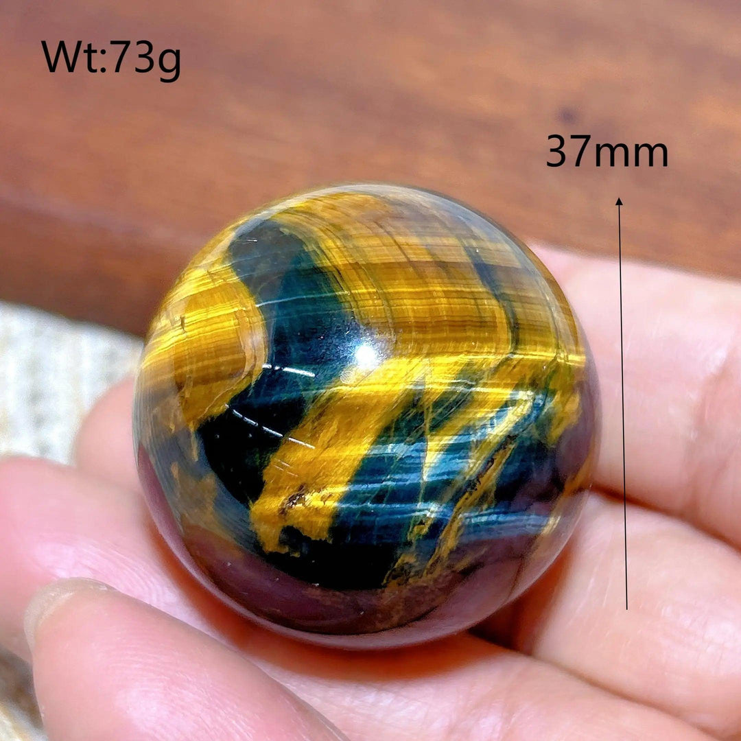 Polished 37mm blue and yellow Tiger Eye crystal sphere, a flashy healing stone ornament for energy and home decor.