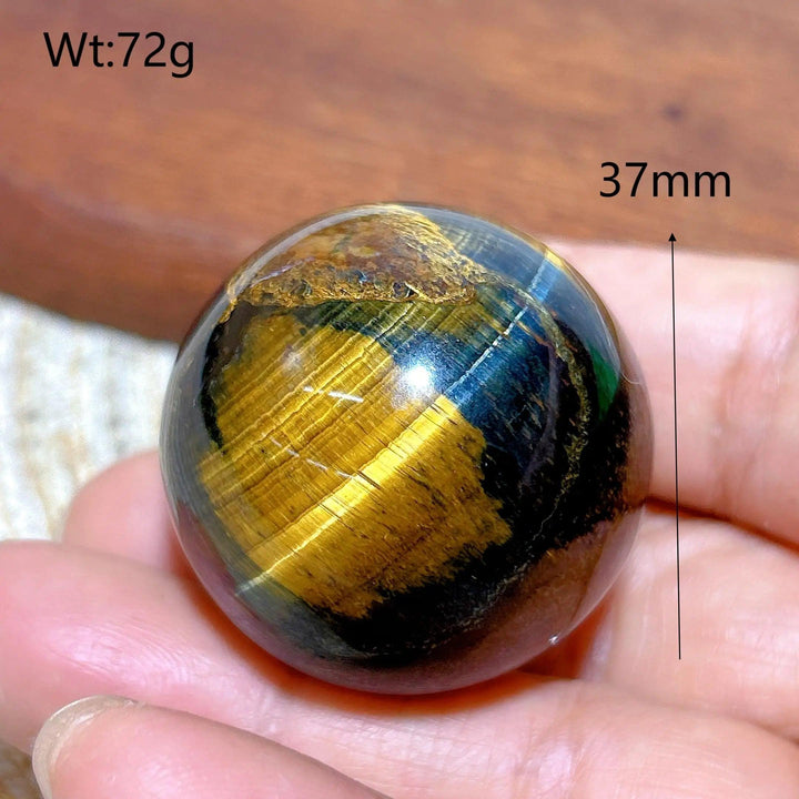 37mm Blue and Yellow Tiger Eye crystal sphere, a polished healing ball with flashy mineral energy for home decor.