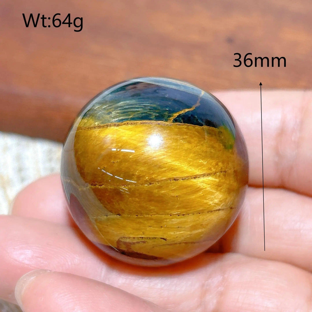 36mm Blue and Yellow Tiger Eye crystal sphere, a polished healing stone ball with flashy, natural mineral energy.