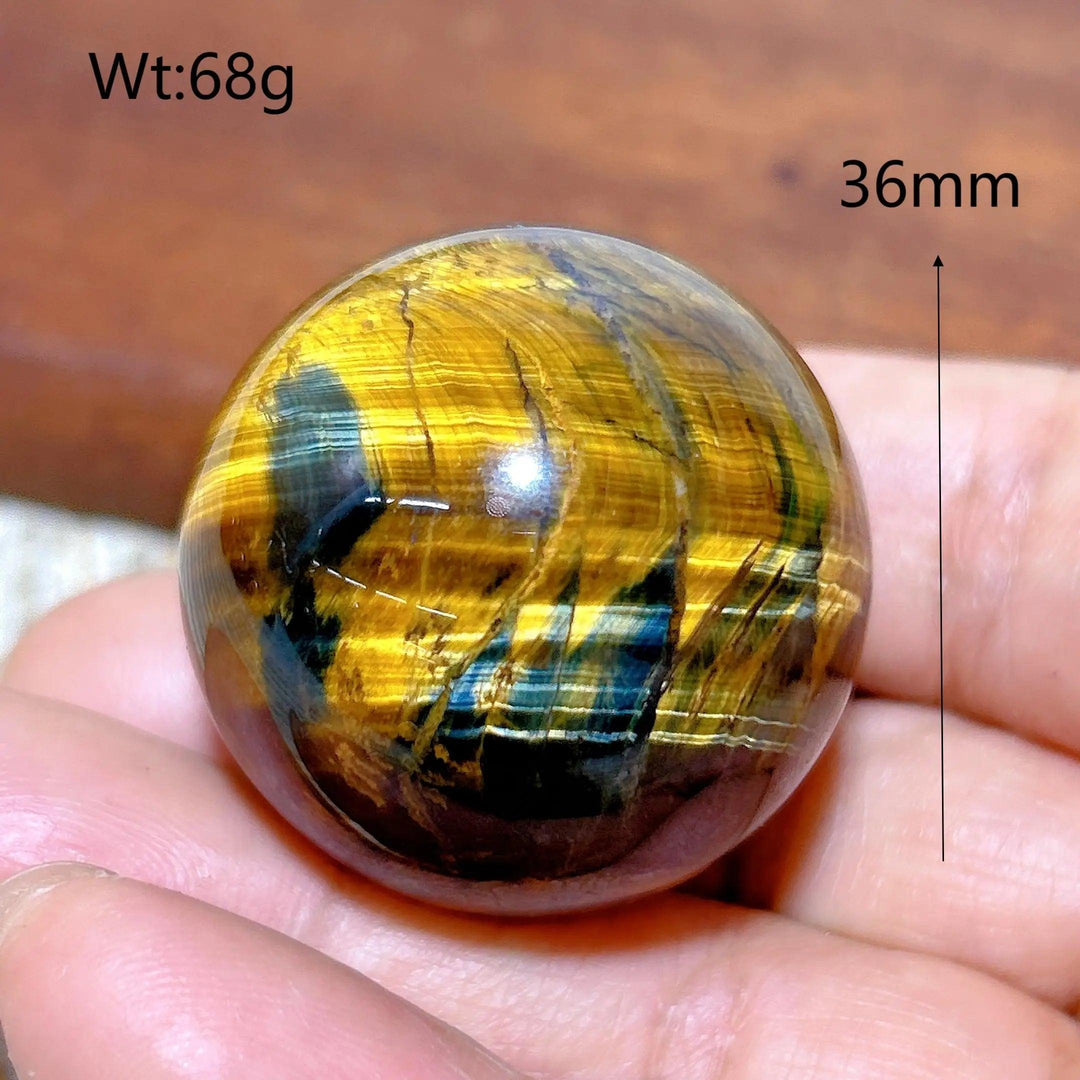 36mm Blue and Yellow Tiger Eye crystal sphere, a polished healing stone ball with flashy, natural mineral energy patterns.