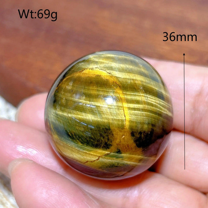 36mm Blue Yellow Tiger Eye crystal sphere, a polished healing stone ball with flashy, natural golden and blue mineral bands.