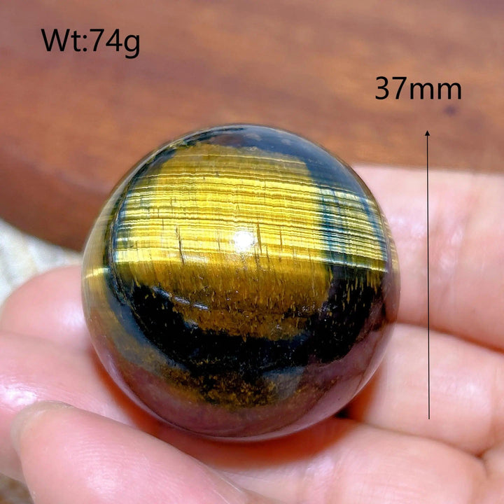 Flashy 37mm Blue Yellow Tiger Eye crystal sphere, a polished natural stone ball perfect for healing and home decor.