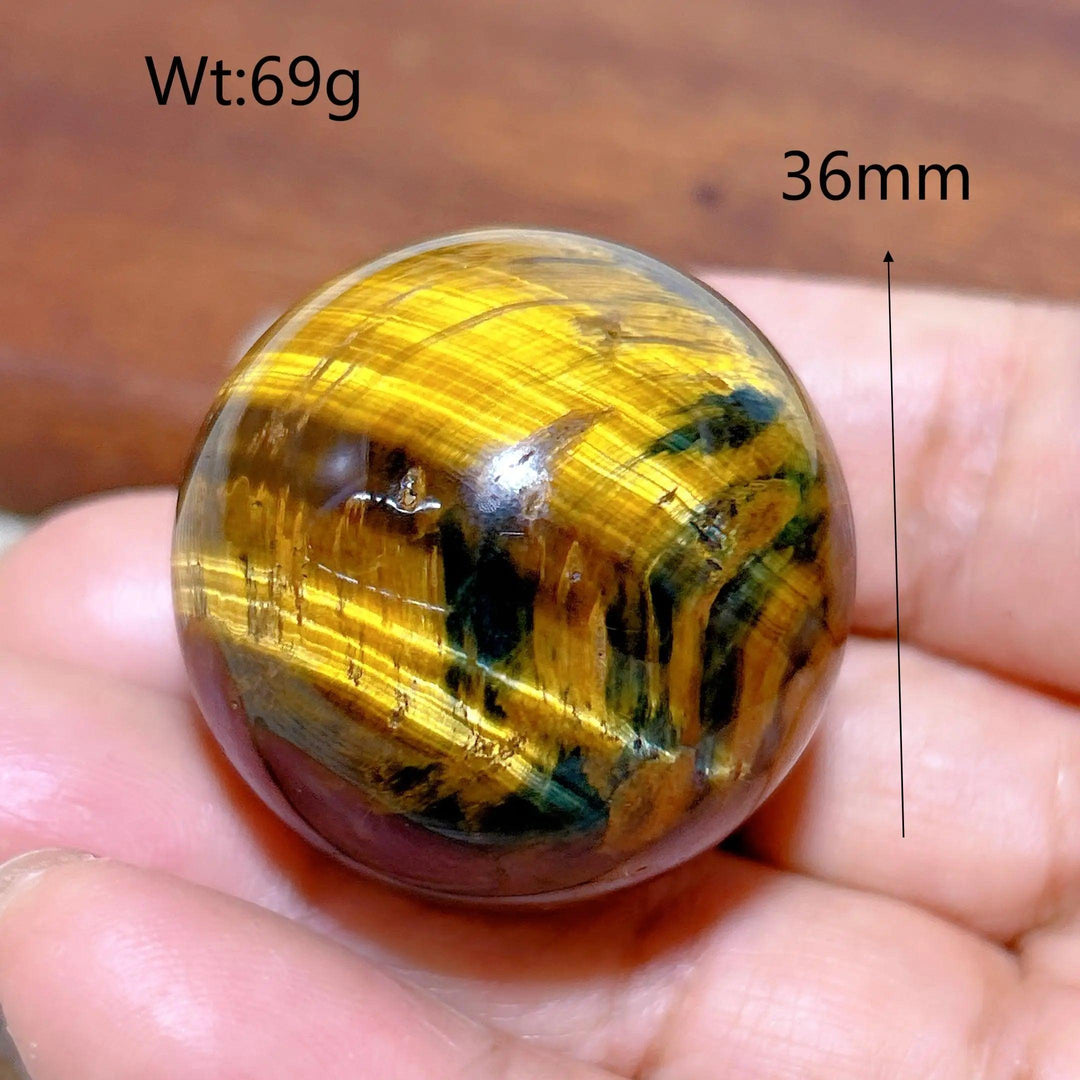 36mm natural blue and yellow Tiger Eye crystal sphere, a polished healing stone ornament with vibrant, flashy patterns.