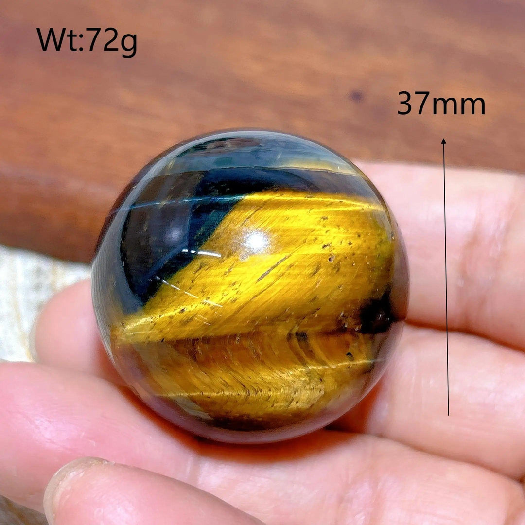 37mm Blue Yellow Tiger Eye crystal sphere, a polished healing stone with flashy natural energy for home decor.