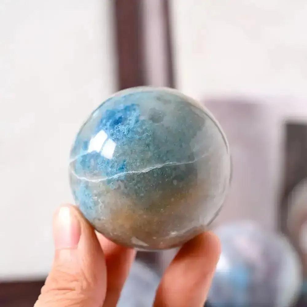 Polished Blue Trolleite sphere by Crystal Destiny, showcasing blue-gray hues for spiritual insight and meditation.