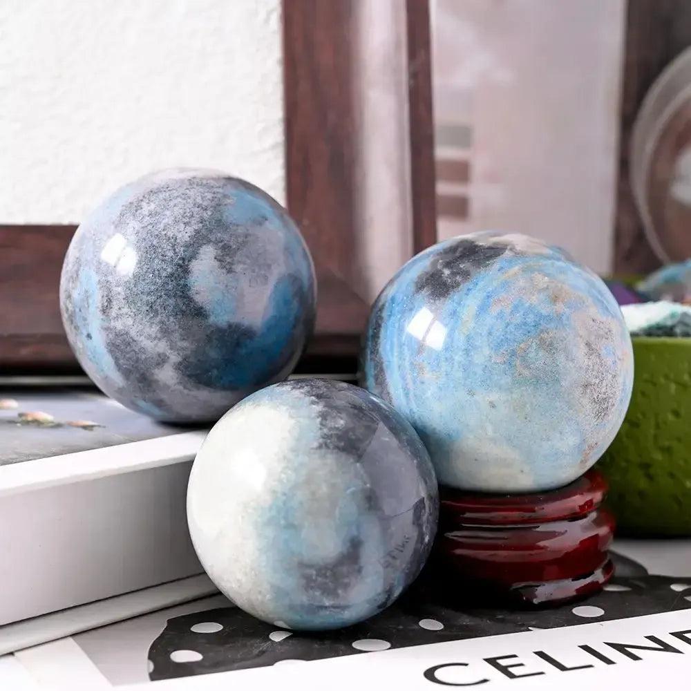 Three polished Blue Trolleite spheres from Crystal Destiny, showcasing captivating blue-gray hues for spiritual awakening.