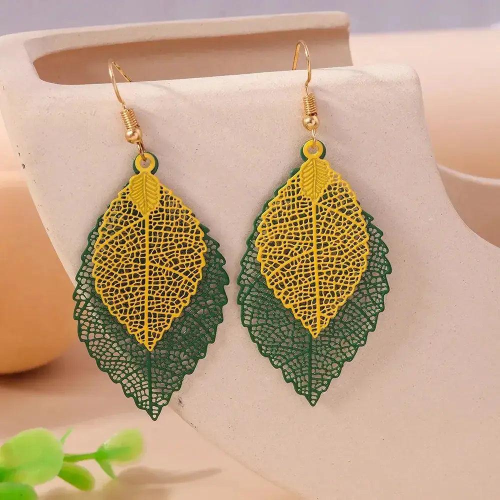 Bohemian Double Leaf Drop Earrings with hollow green and yellow gradient leaves, perfect for a festival-ready look.