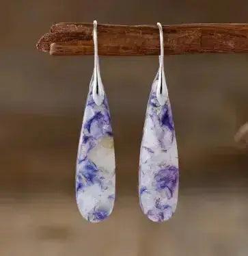 Bohemian Empire Jasper Teardrop Earrings from Crystal Destiny, featuring elongated purple and white stones on silver hooks.