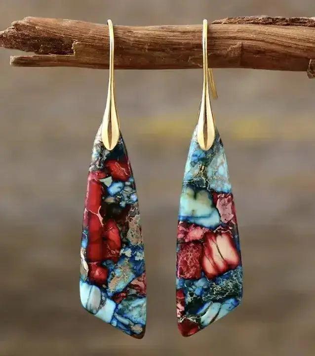 Bohemian Empire Jasper teardrop earrings by Crystal Destiny, featuring unique red and blue patterned stones on gold hooks.