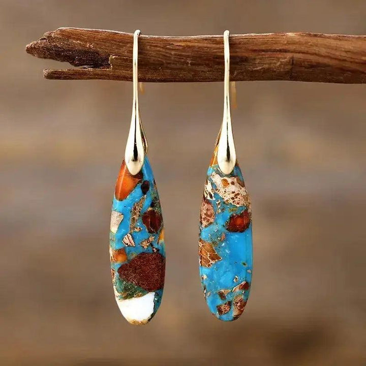 Bohemian Empire Jasper Teardrop Earrings from Crystal Destiny, featuring unique blue, brown, and white stones on gold hooks.