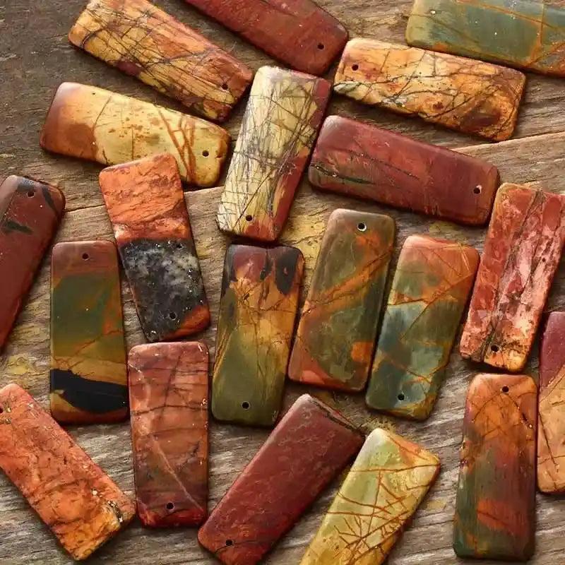 Boho Picasso Jasper drop earrings by Crystal Destiny, featuring unique abstract patterns in warm tans, creams, blacks, and reds.