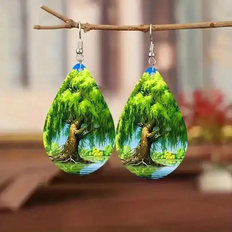 Boho wooden water drop earrings with a vibrant 2D printed weeping willow tree design over water.