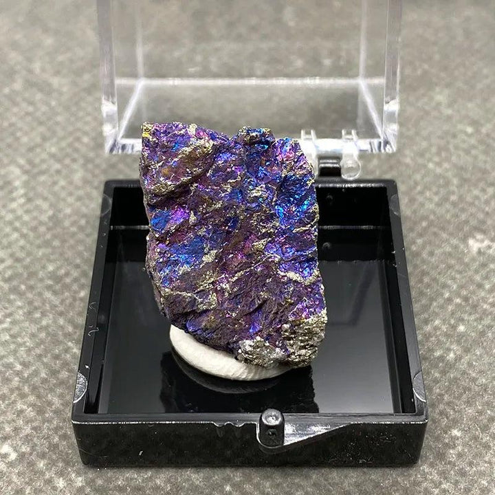 Raw Bornite Peacock Ore specimen with metallic Pyrite, featuring iridescent purple and gold hues for manifestation.