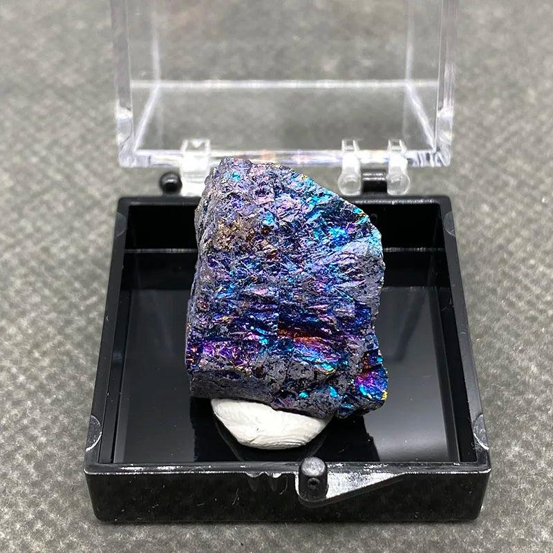 Raw Bornite Peacock Ore specimen with iridescent blue, purple, and gold colors in a display box for manifestation.