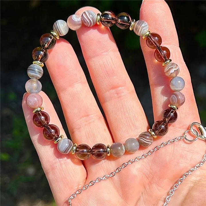 Overthinker bracelet with Botswana agate and smoky quartz beads, gold spacers, for wisdom and strength.