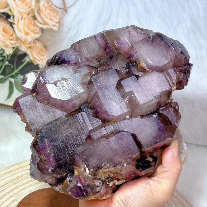 Large raw Brazilian amethyst skeletal elestial cluster with deep violet, stepped crystal points for calm energy.