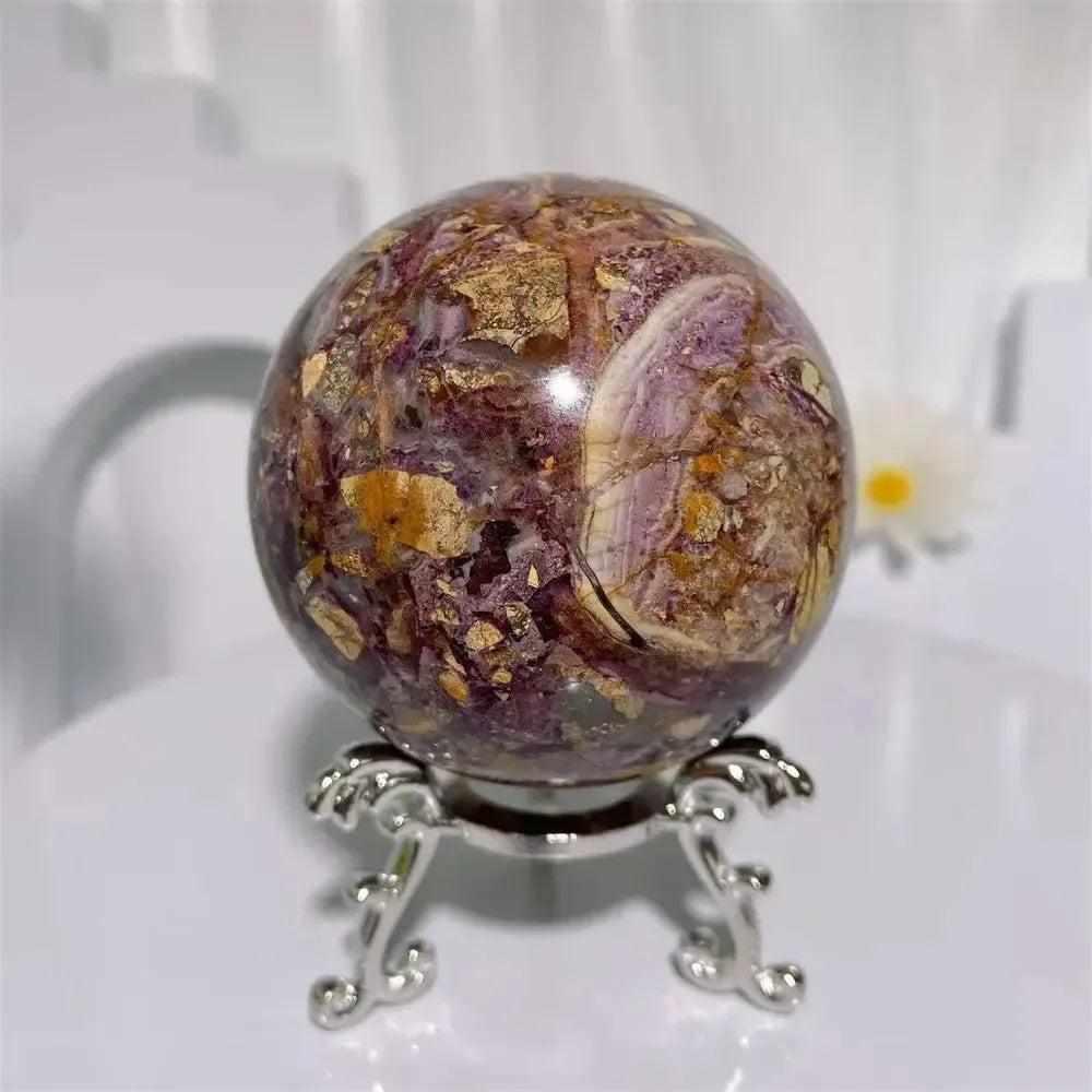 Grounding Brecciated Jasper crystal sphere with bold red, brown, and cream fractured patterns on a decorative stand.