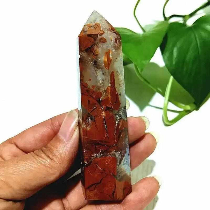 Polished Brecciated Jasper tower featuring a bold red and brown mosaic pattern for grounding and root chakra balance.