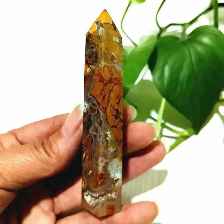 Polished Brecciated Jasper tower featuring warm red and brown mosaic patterns for grounding and Root Chakra healing.