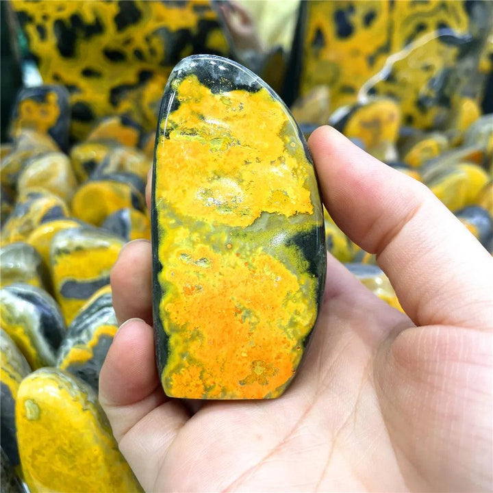 Polished Bumblebee Jasper crystal freeform with vibrant yellow and black bands for solar plexus energy.