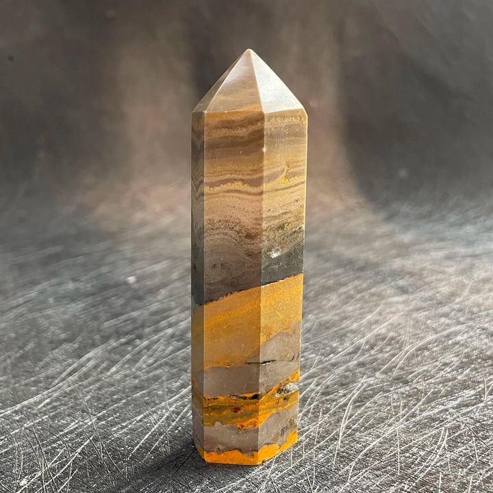 Bumblebee Jasper Crystal Tower with yellow, grey, and orange banding for solar plexus energy.