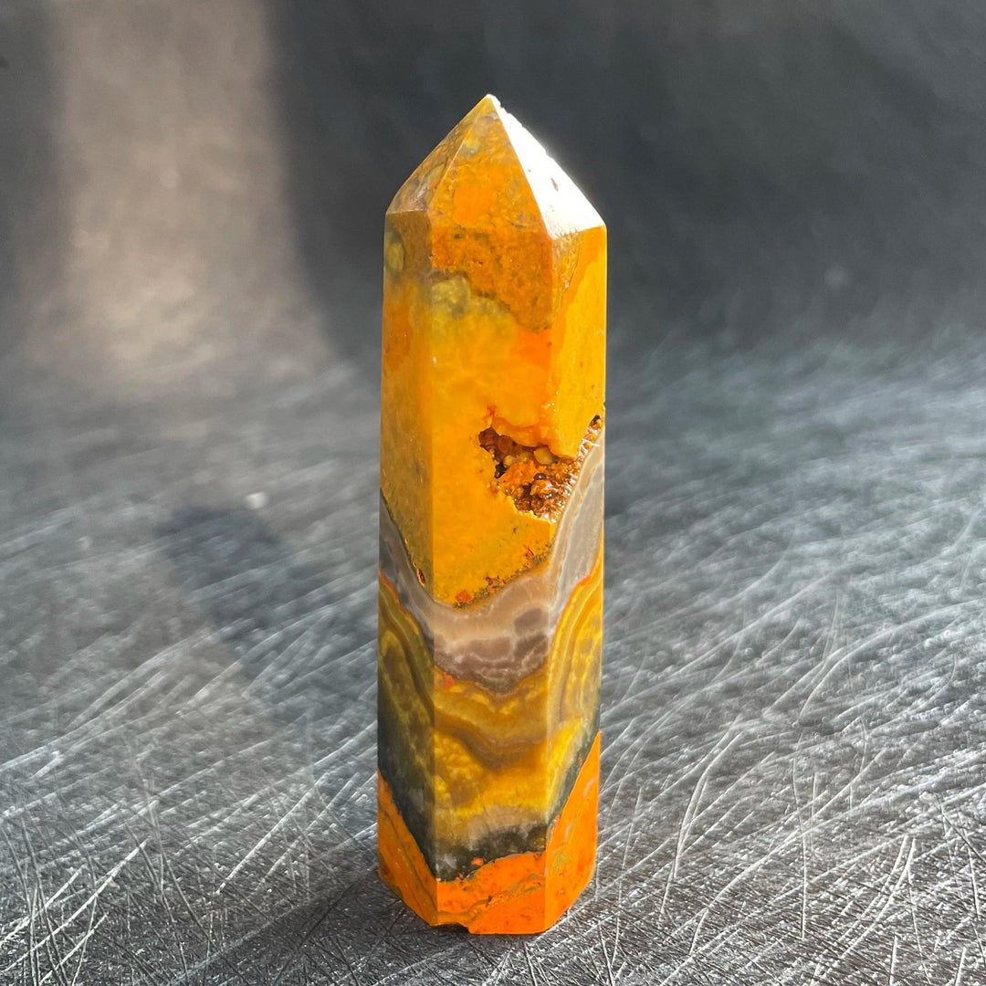 Bumblebee Jasper Crystal Tower with vibrant yellow and orange banding for solar plexus energy.