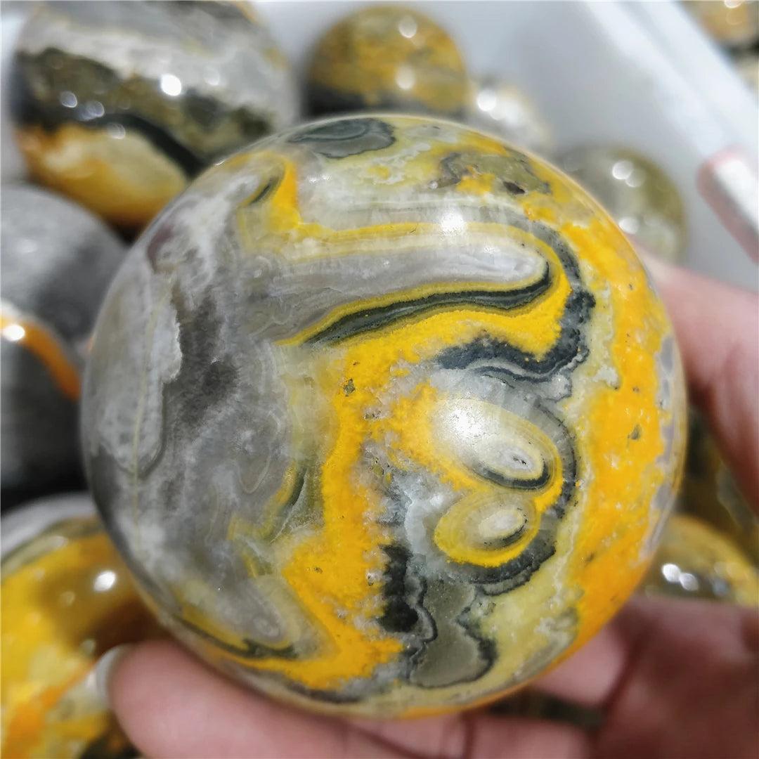 Bumblebee Jasper Crystal Sphere with vibrant yellow, orange, and black volcanic bands for solar plexus energy.
