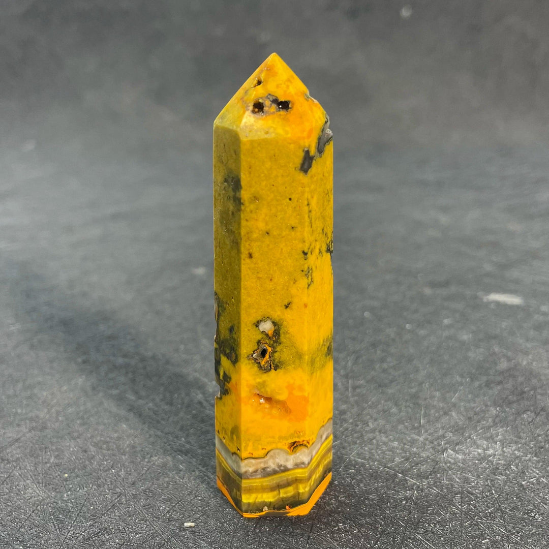 Vibrant Bumblebee Jasper Crystal Tall Tower with yellow, orange, and black banding for solar plexus energy.