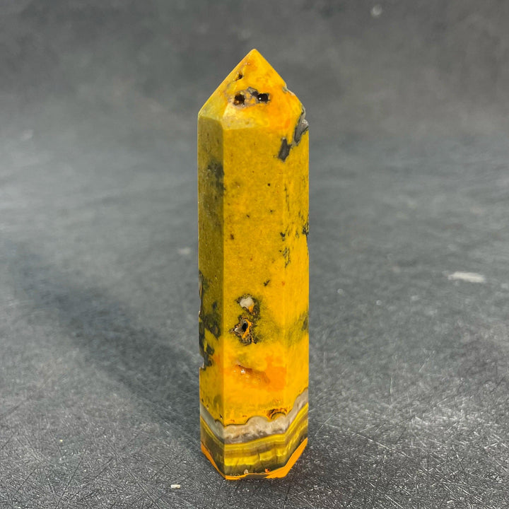 Vibrant Bumblebee Jasper Crystal Tall Tower with yellow, orange, and black banding for solar plexus energy.