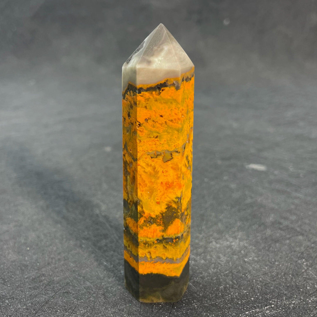 Bumblebee Jasper Crystal Tall Tower with vibrant orange, yellow, and black bands for solar plexus energy.