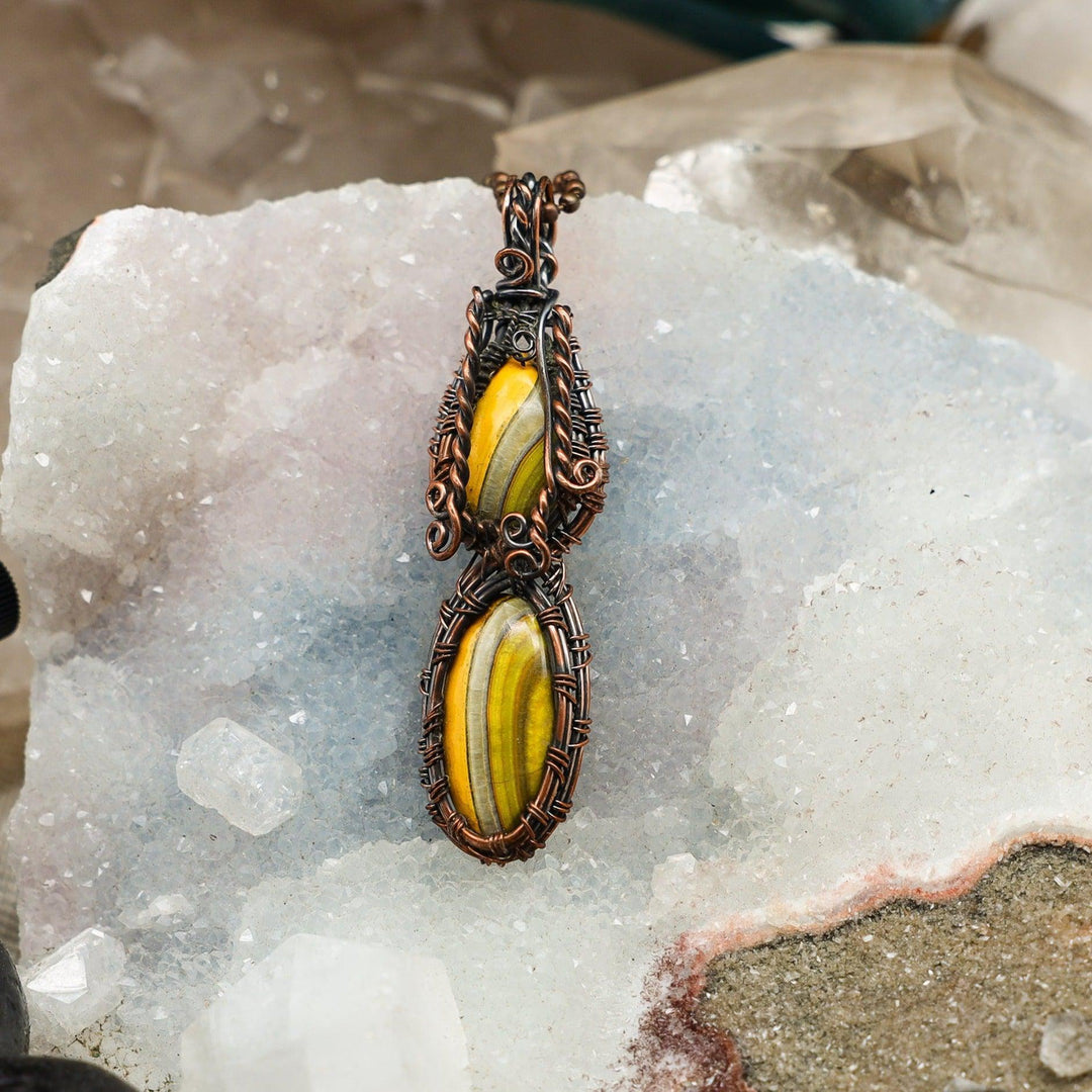 Dual Bumblebee Jasper Wire Wrap Pendant with vibrant yellow, orange, black, and white stones in handcrafted copper.