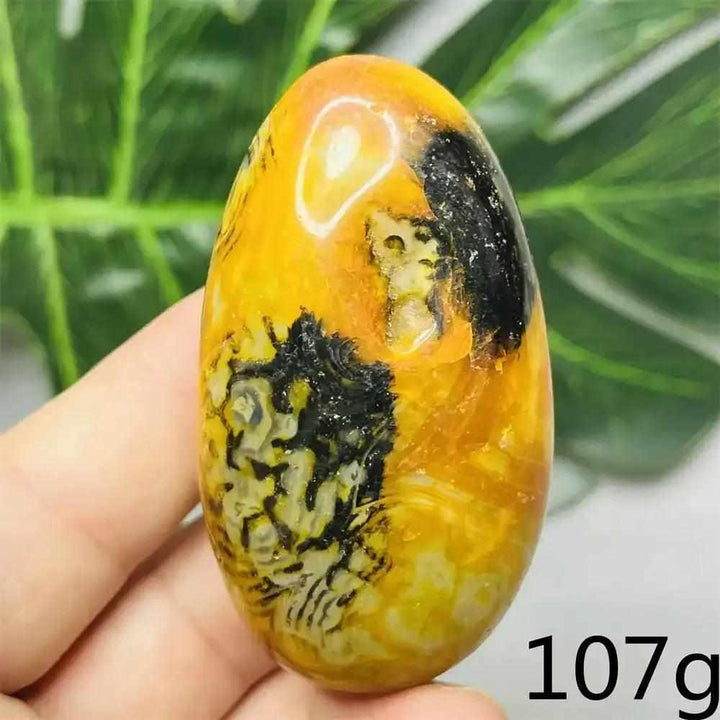 Smooth Bumblebee Jasper palm stone featuring vibrant yellow, orange, and black stripes for optimism and motivation.