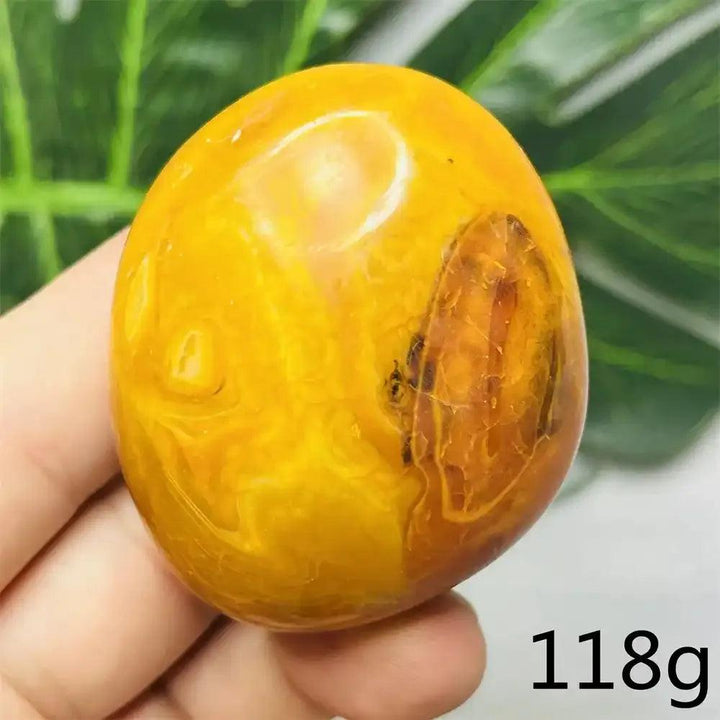 Polished 118g Bumblebee Jasper palm stone featuring vibrant yellow and orange bands for Solar Plexus chakra energy.