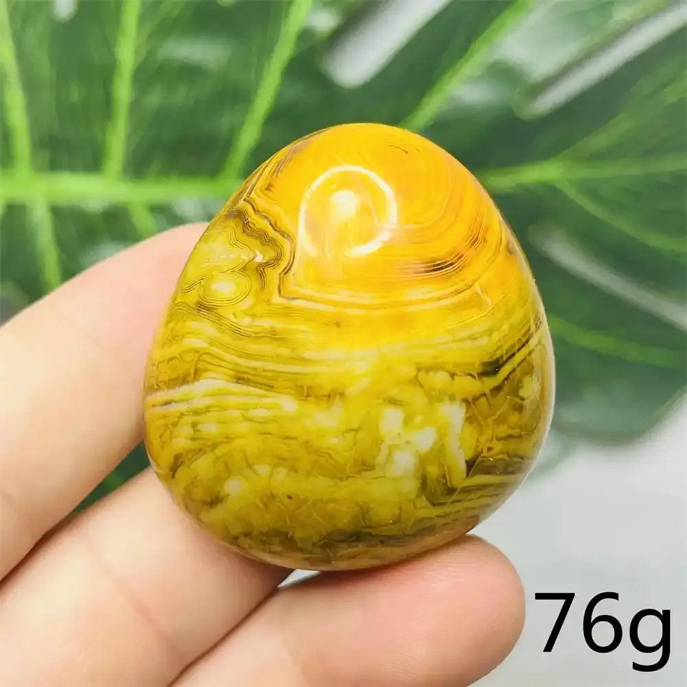 Smooth 76g Bumblebee Jasper palm stone featuring vibrant yellow, orange, and black stripes for optimism and motivation.