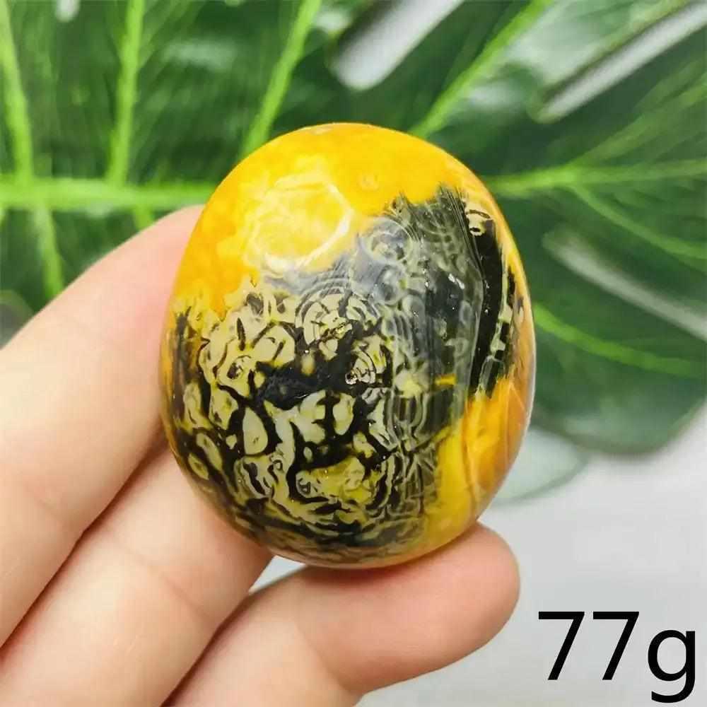 Smooth 77g Bumblebee Jasper palm stone featuring vibrant yellow, orange, and black stripes for motivation and energy.