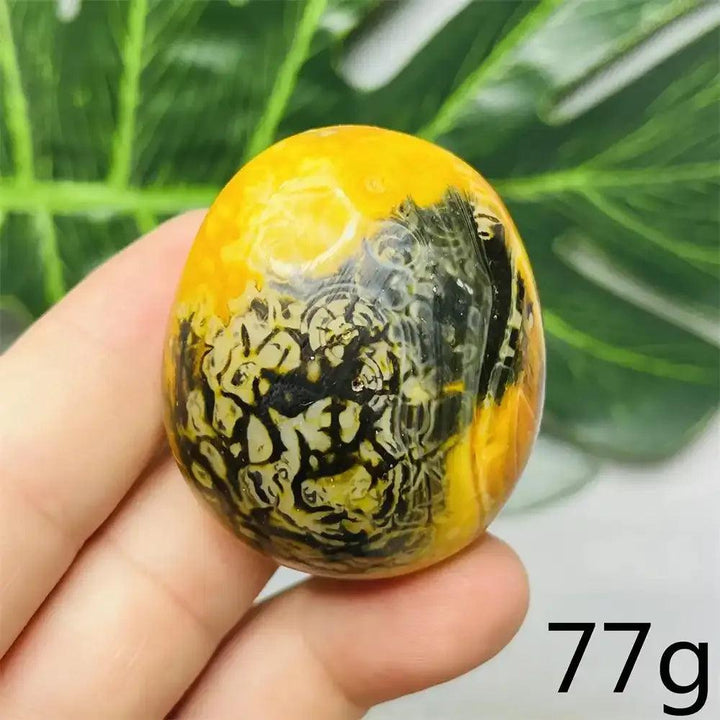 Smooth 77g Bumblebee Jasper palm stone featuring vibrant yellow, orange, and black stripes for motivation and energy.